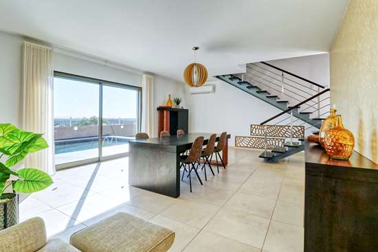 Contemporary villa (could be 2) with 4 or 5 bedrooms over split levels,  heated pool & views.