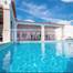 VILLA V4 avec piscine insérée dans un terrain de 1000 m2 situé à 1 km des plages.